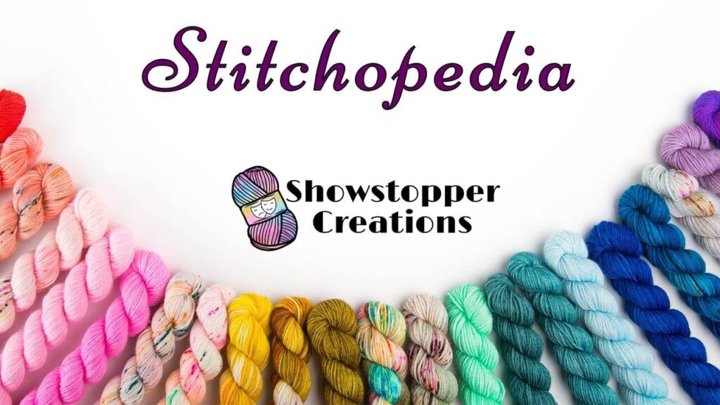 Text reading "Stitchopedia" across top, and "Showstopper Creations" across the middle. Images of various color skeins of yarn are in an arc across bottom.